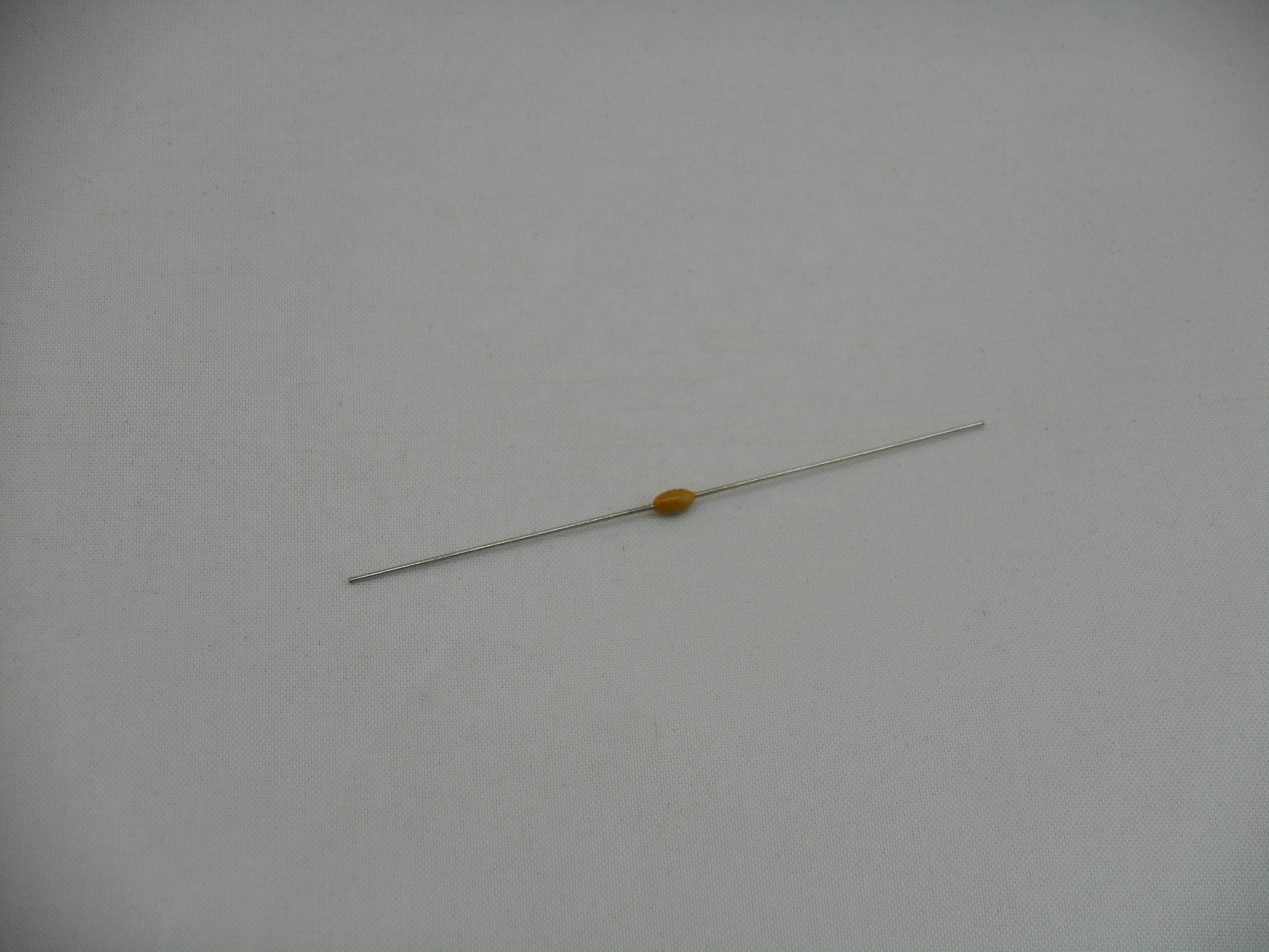 .01uF 100V Axial Ceramic Capacitor (MC1046)